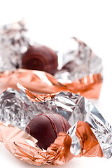 Image showing two opened foil candies
