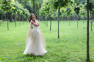 Image showing girl peers into sky