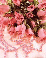 Image showing Pink roses with pink beads