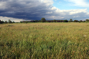 Image showing Storm clouds over the field