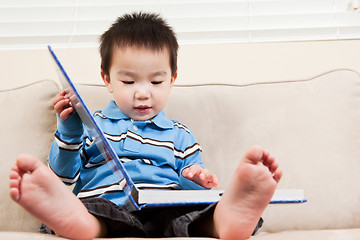 Image showing Boy reading a book