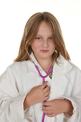 Image showing young girl pretending to be a doctor