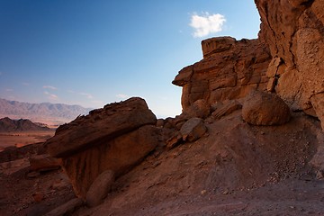 Image showing Scenic weathered orange rock in stone desert on sunset