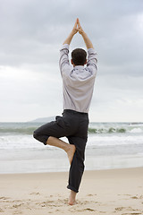 Image showing Businessman doing relaxation exercises