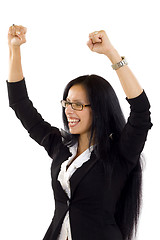 Image showing beautiful young business woman raising arms