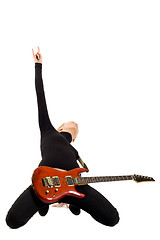 Image showing girl playing an electric guitar on her knees