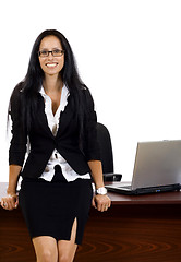 Image showing business woman against desk