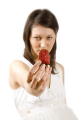 Image showing sexy young woman holding fresh strawberry