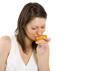 Image showing young woman with orange slice