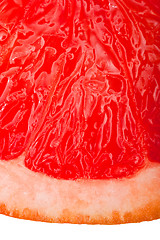 Image showing Extreme macro shot of a red grapefruit isolated on white