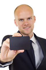 Image showing Business man handing a blank business card