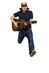 Image showing passionate guitarist jumps