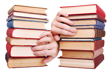 Image showing pile of old books and hand