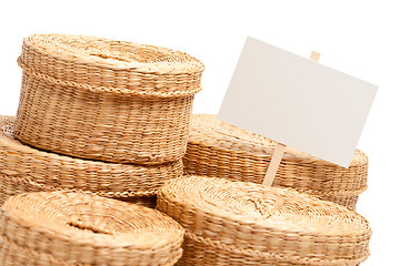 Image showing Various Sized Wicker Baskets with Blank Sign on White