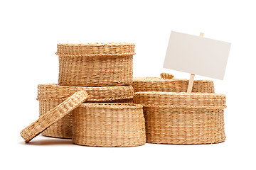 Image showing Various Sized Wicker Baskets with Blank Sign on White