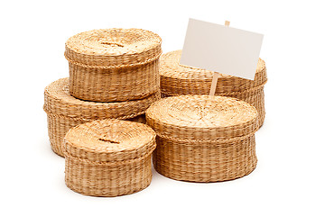 Image showing Various Sized Wicker Baskets with Blank Sign on White