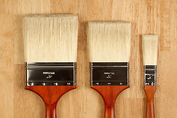 Image showing Paint Brushes on Wood Surface