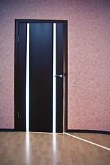 Image showing Light from behind the door