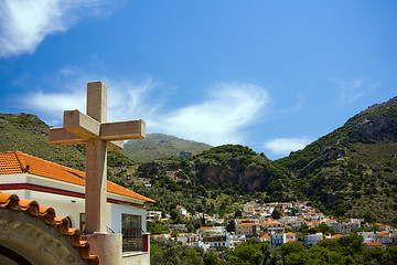 Image showing Cross above the town