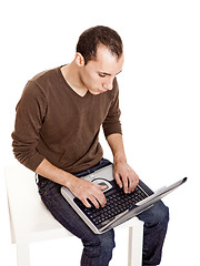 Image showing Working with a laptop