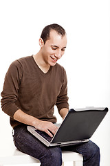 Image showing Working with a laptop