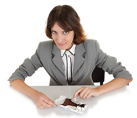 Image showing young girl with a chocolate bar in his hand