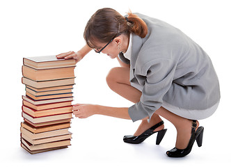 Image showing woman and a pile of books