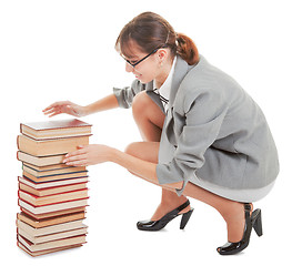 Image showing woman and a pile of books