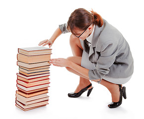Image showing woman and a pile of books