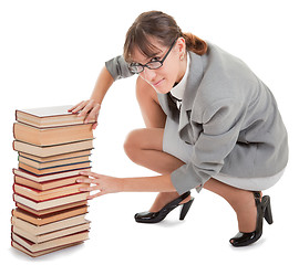 Image showing woman and a pile of books