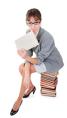 Image showing woman and a pile of books