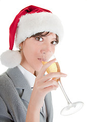 Image showing business girl in Santa hat and with champagne