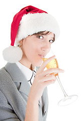 Image showing business girl in Santa hat and with champagne