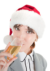Image showing business girl in Santa hat and with champagne