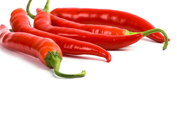 Image showing five red chilli peppers