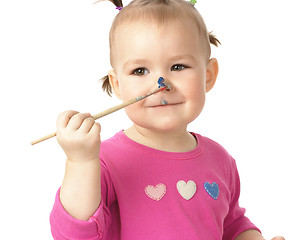 Image showing Little girl paint on her nose