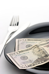 Image showing Dollars on plate with fork and knife