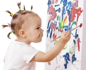 Image showing Little girl paint on a board