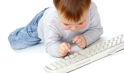 Image showing Cute child typing on a keyboard