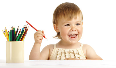 Image showing Happy child play with color pencils and smile