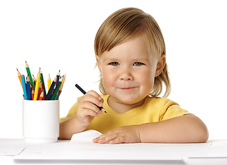 Image showing Child draw with crayons and smile