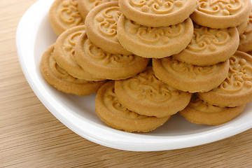 Image showing Yellow cookies on plate