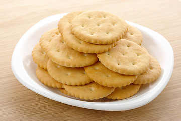 Image showing Yellow crackers on plate
