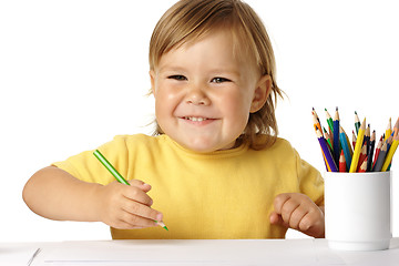 Image showing Happy child play with crayons and smile