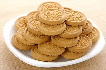 Image showing Yellow cookies on plate