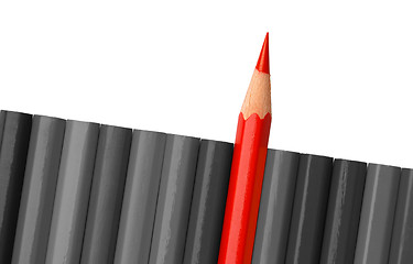 Image showing Single red crayon is sticking out of the gray row