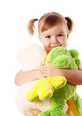 Image showing Cute girl embracing her soft toys