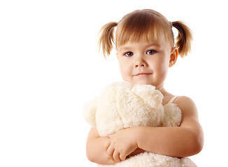 Image showing Cute girl embracing her teddy bear