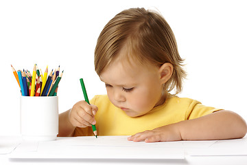 Image showing Child draw with green crayon