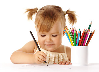 Image showing Cute child draw with color pencils